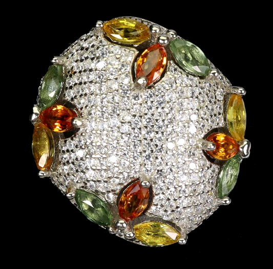 Diamanté ring with multicolored gemstones on a black background