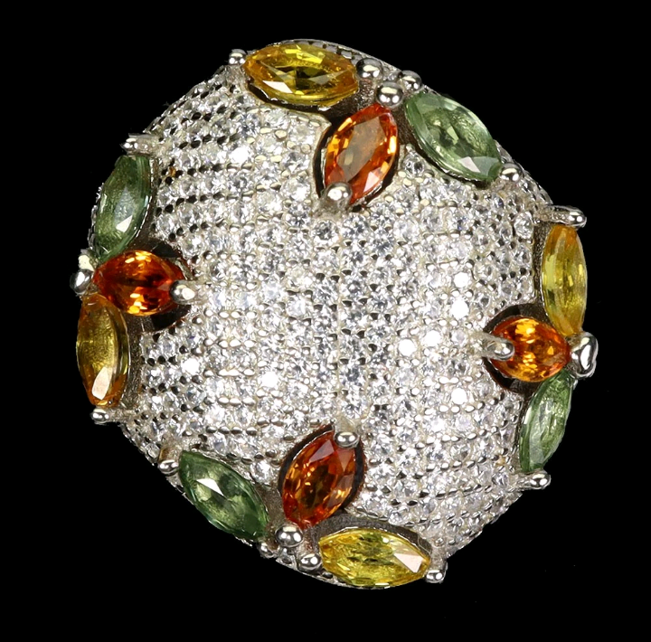 Diamanté ring with multicolored gemstones on a black background