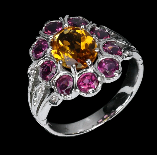 Sterling silver citrine and rhodolite garnet ring with 14k white gold plating - oval cut Brazilian citrine center stone surrounded by pink garnets
