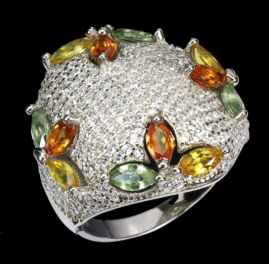 Silver ring with colorful gemstones on a black background