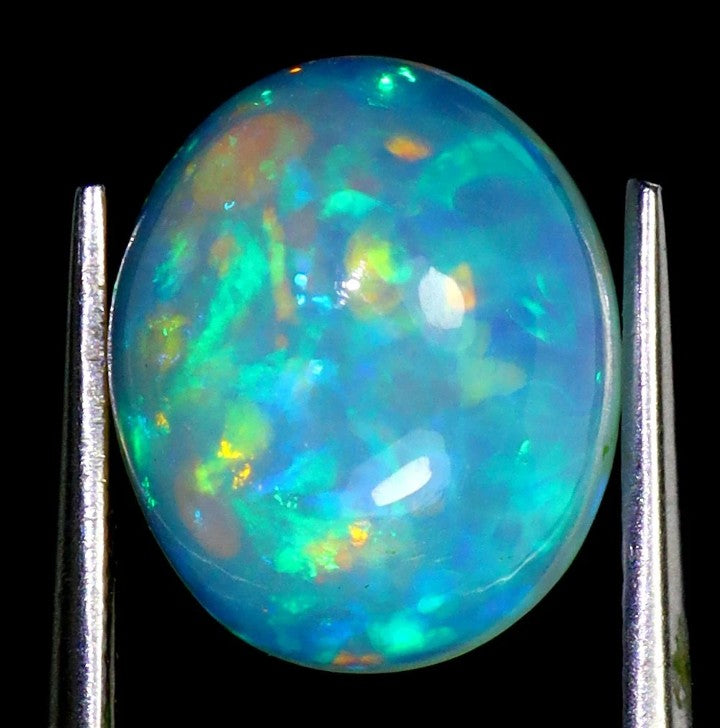 Natural Ethiopian Fire Opal 3.75ct - AAA Rainbow Luster Oval Cabochon